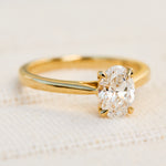 oval lab grown diamond yellow gold engagement ring