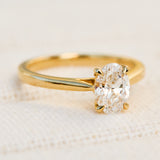 oval lab grown diamond yellow gold engagement ring