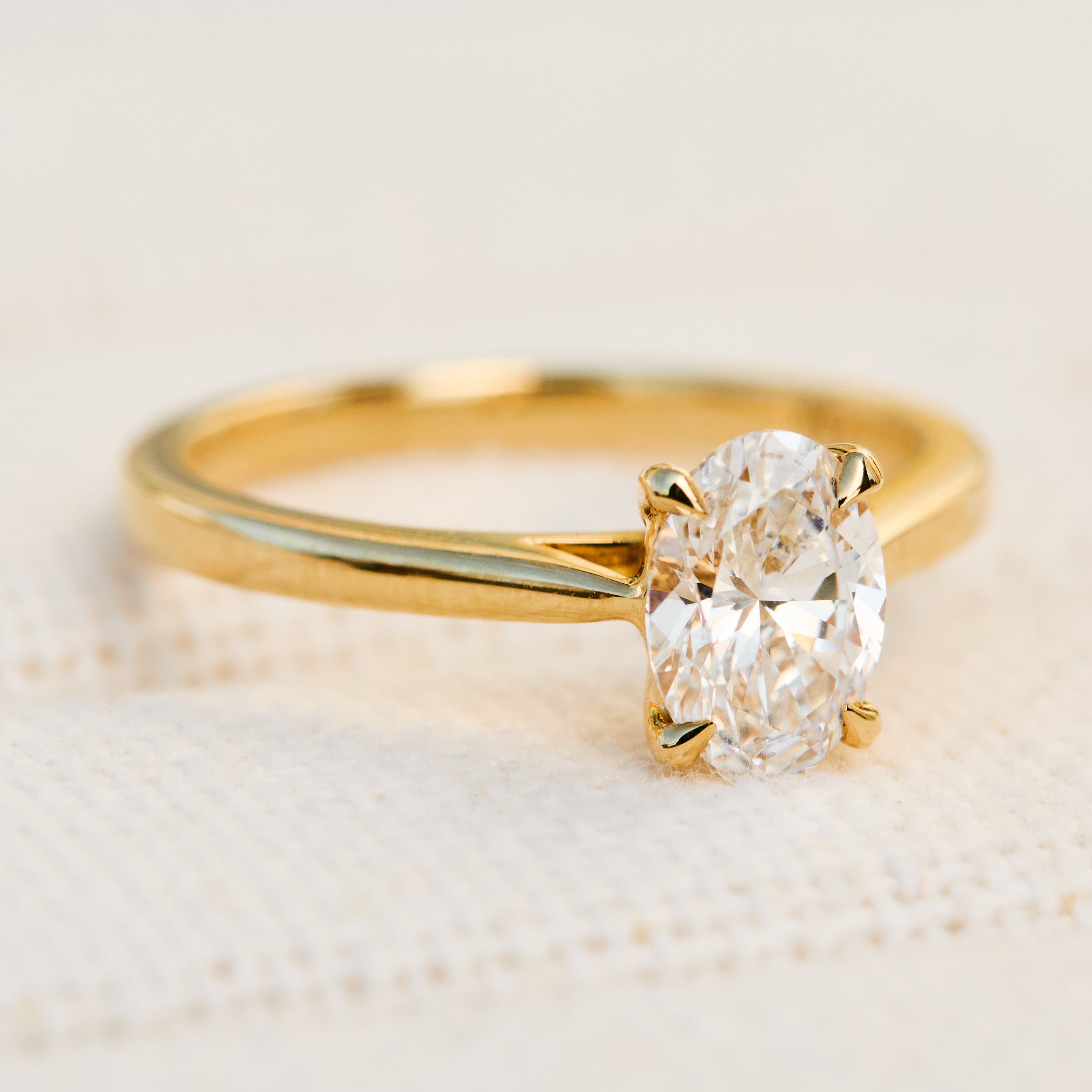 oval lab grown diamond yellow gold engagement ring