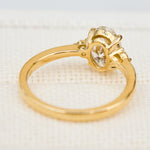 oval lab grown diamond yellow gold trilogy engagement ring