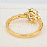 oval lab grown diamond yellow gold trilogy engagement ring