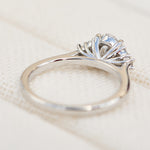 oval lab grown diamond ring in platinum paired with six round brilliant side diamonds