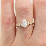 oval lab grown diamond engagement ring set in timeless yellow gold
