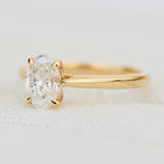 oval lab grown diamond engagement ring in yellow gold