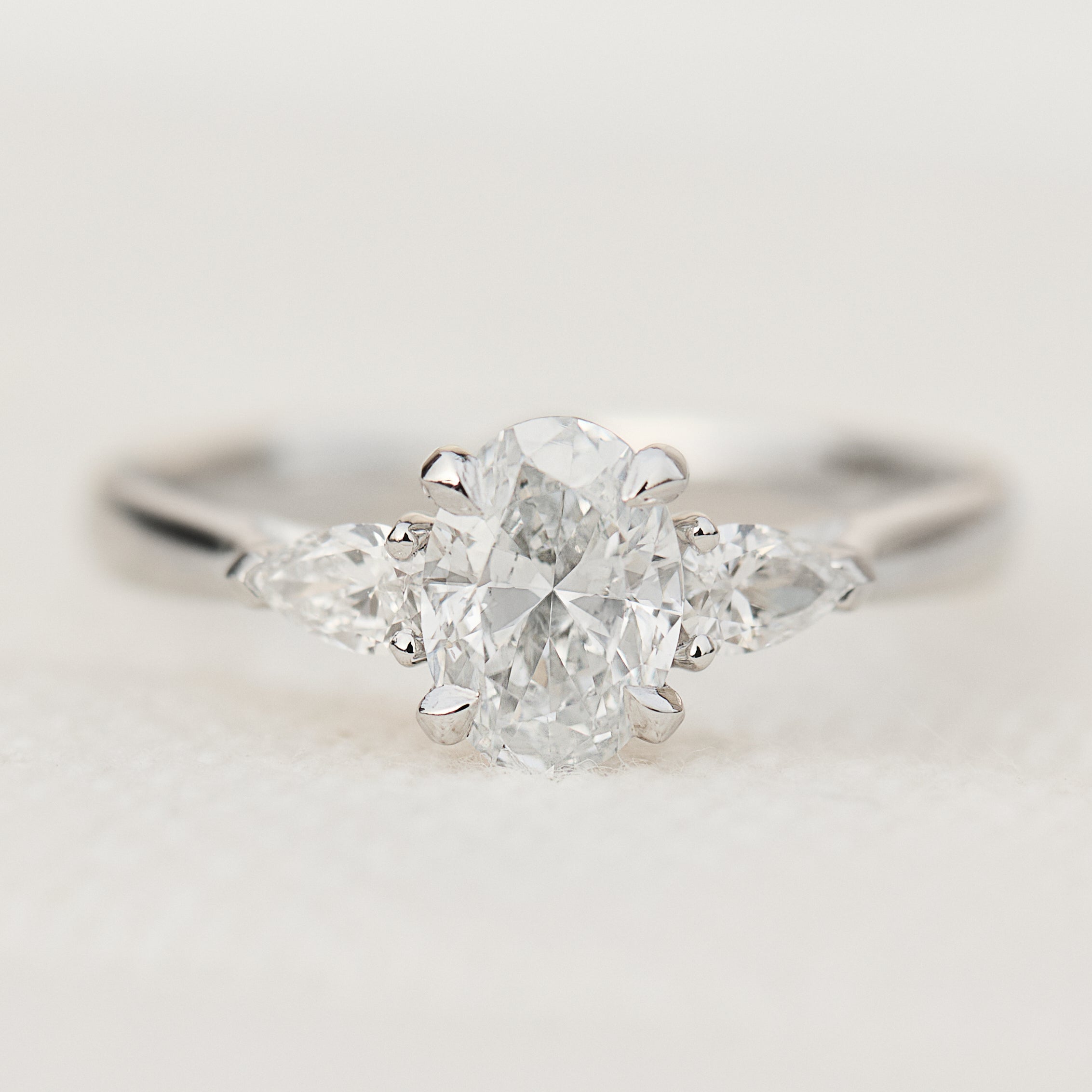 oval lab grown diamond trilogy engagement ring in platinum