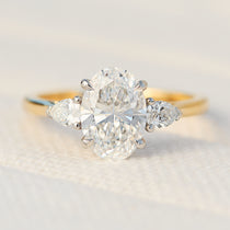 oval lab grown diamond yellow gold and platinum engagement ring