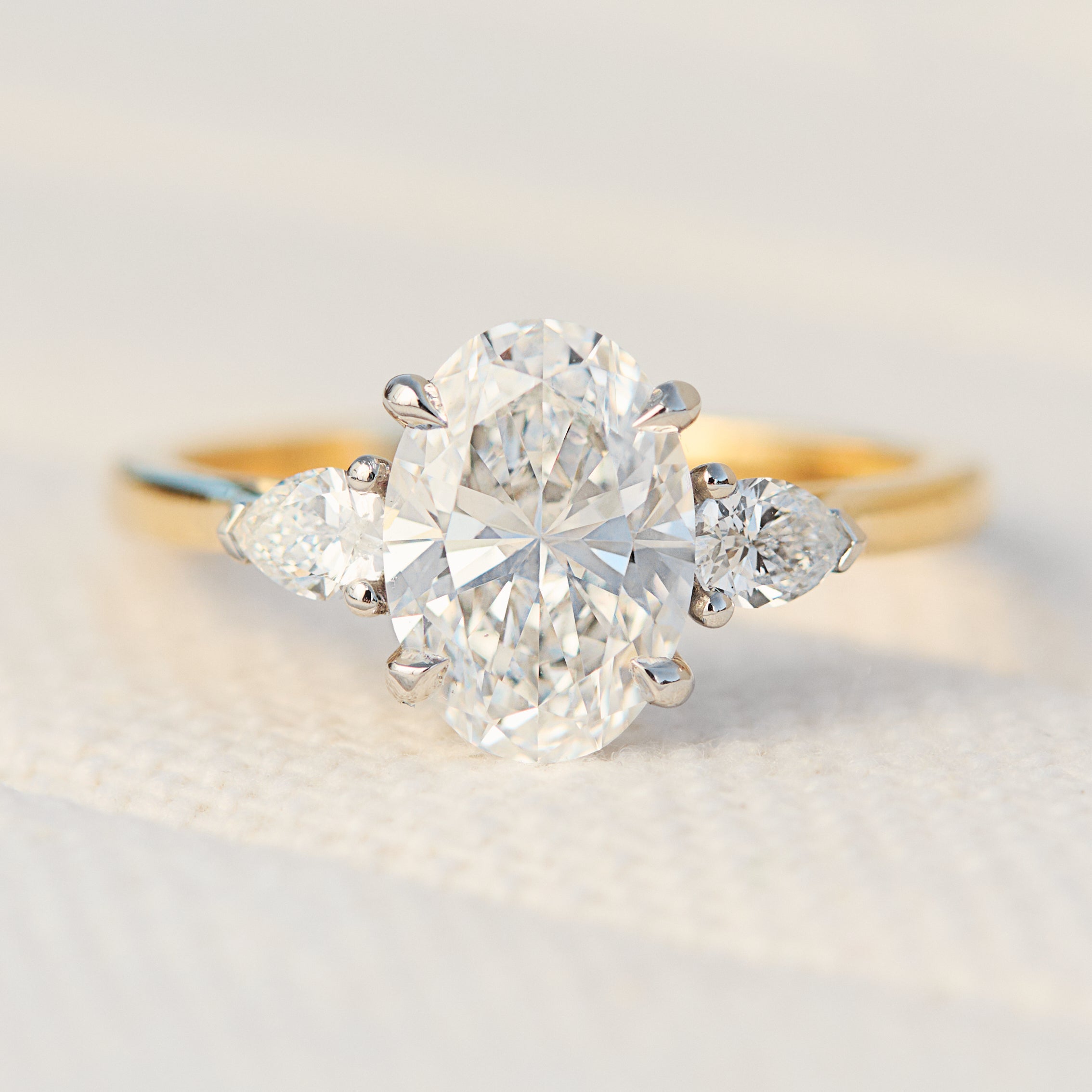 oval lab grown diamond yellow gold and platinum engagement ring
