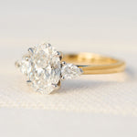 oval lab grown diamond yellow gold and platinum engagement ring