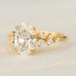 oval lab grown diamond yellow gold engagement cluster ring
