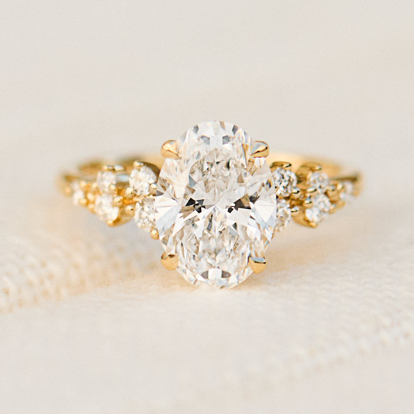 oval lab grown diamond yellow gold engagement cluster ring