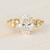 oval lab grown diamond yellow gold engagement cluster ring