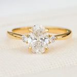 oval lab grown diamond yellow gold trilogy engagement ring