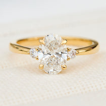 oval lab grown diamond yellow gold trilogy engagement ring