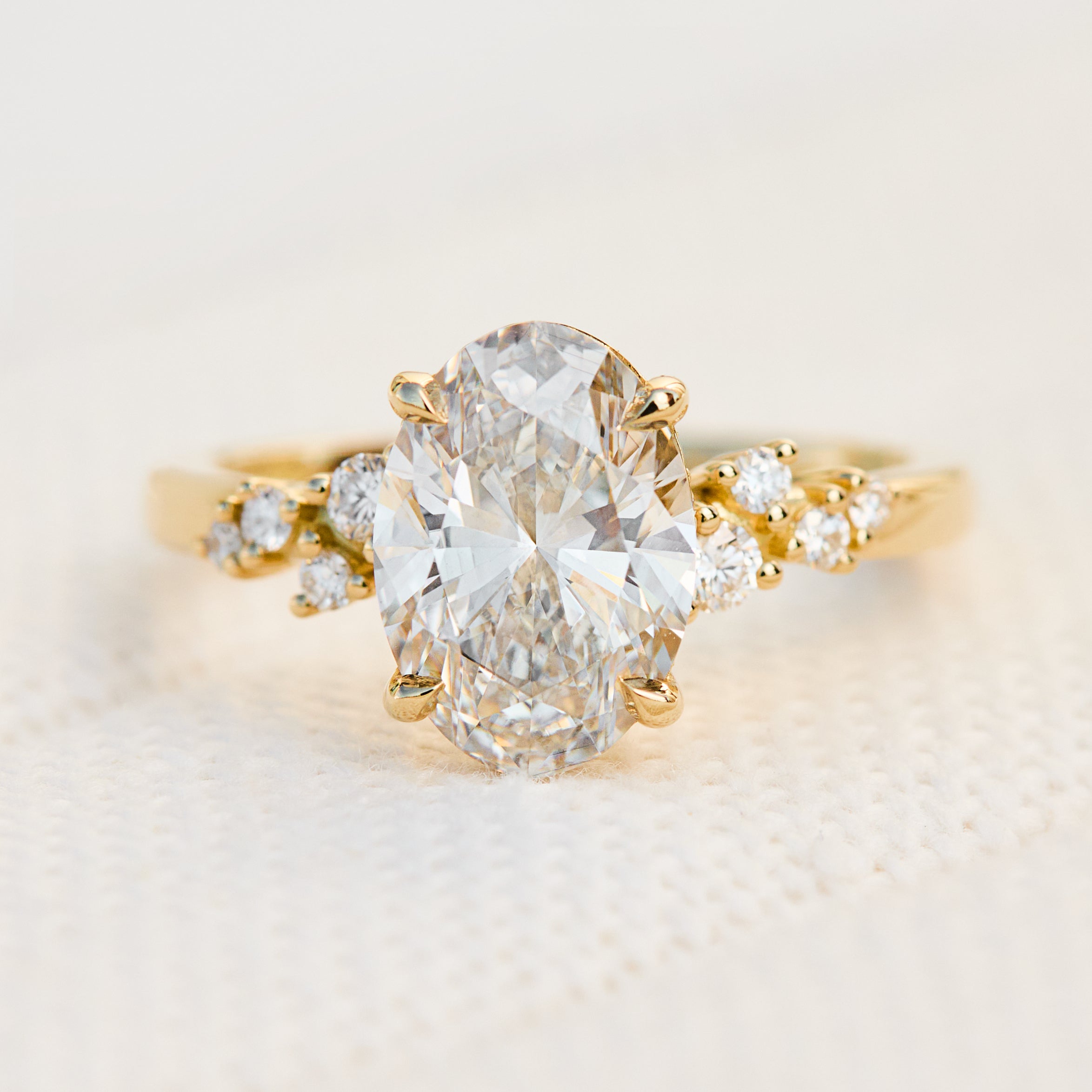 oval lab grown one of a kind diamond engagement ring set in yellow gold