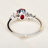 oval lab grown ruby engagement ring in platinum