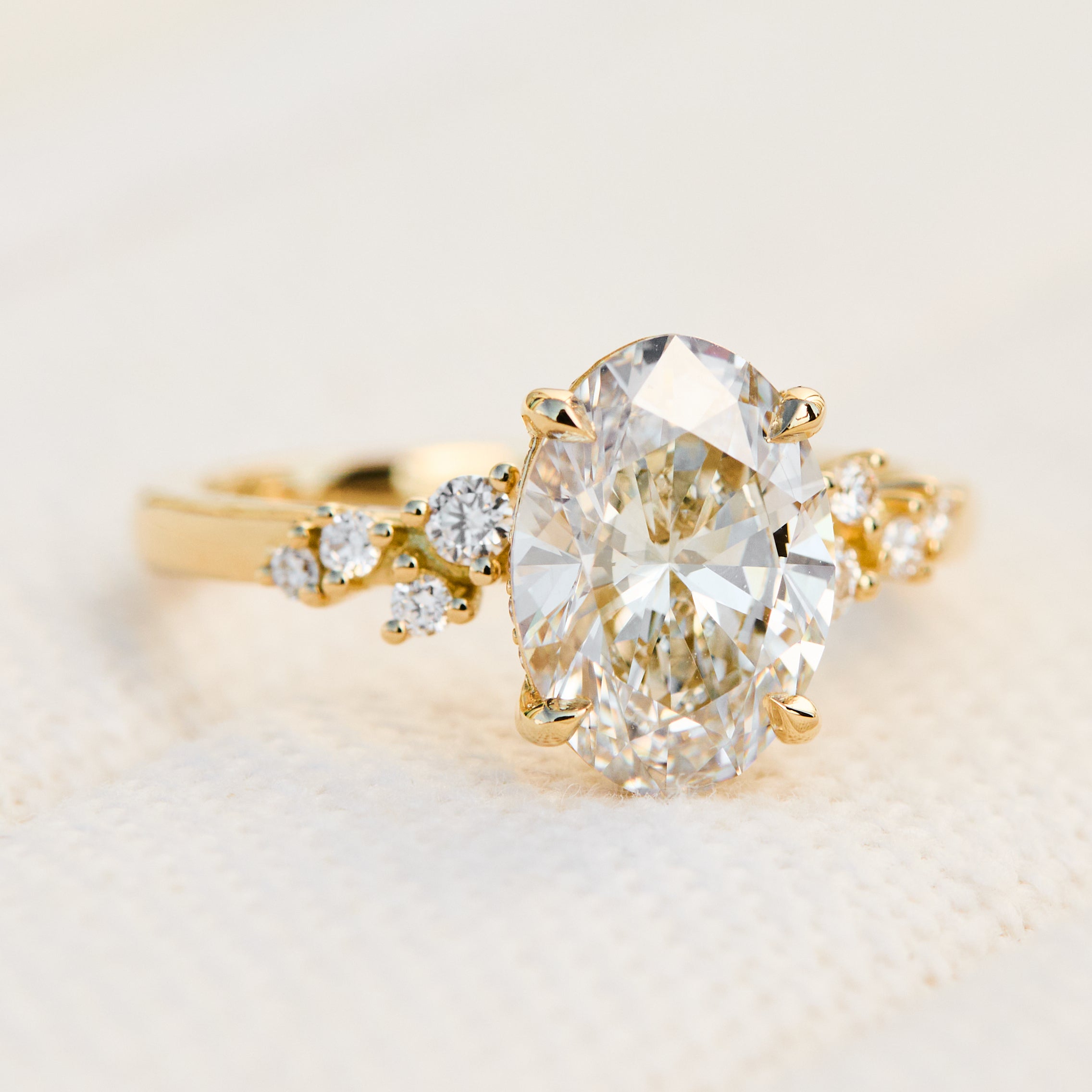 oval lab grown one of a kind diamond engagement ring set in yellow gold