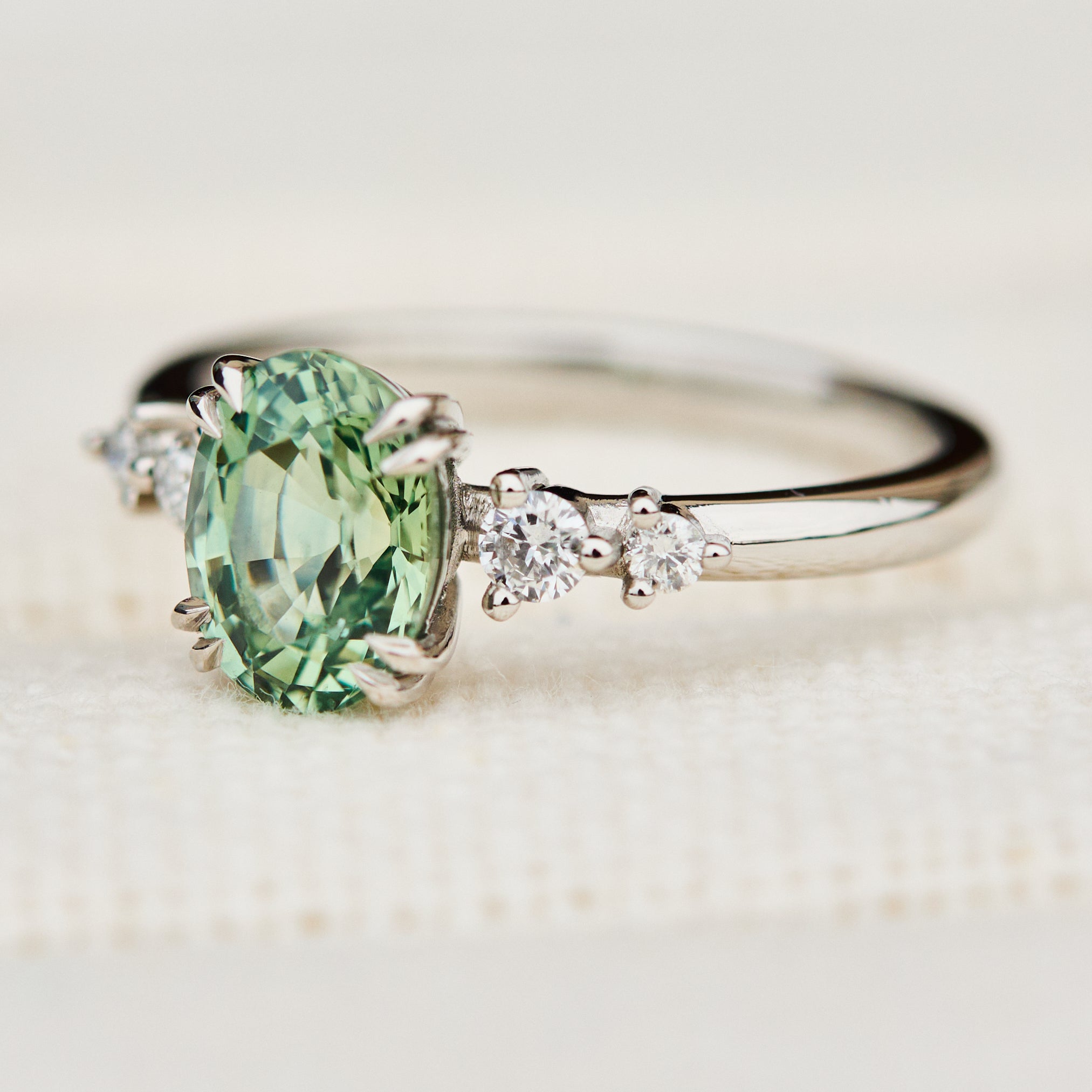 oval mint green montana sapphire engagement ring set in platinum