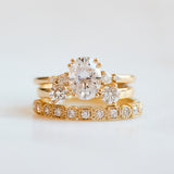cushion cut moissanite and diamond engagement ring in yellow gold