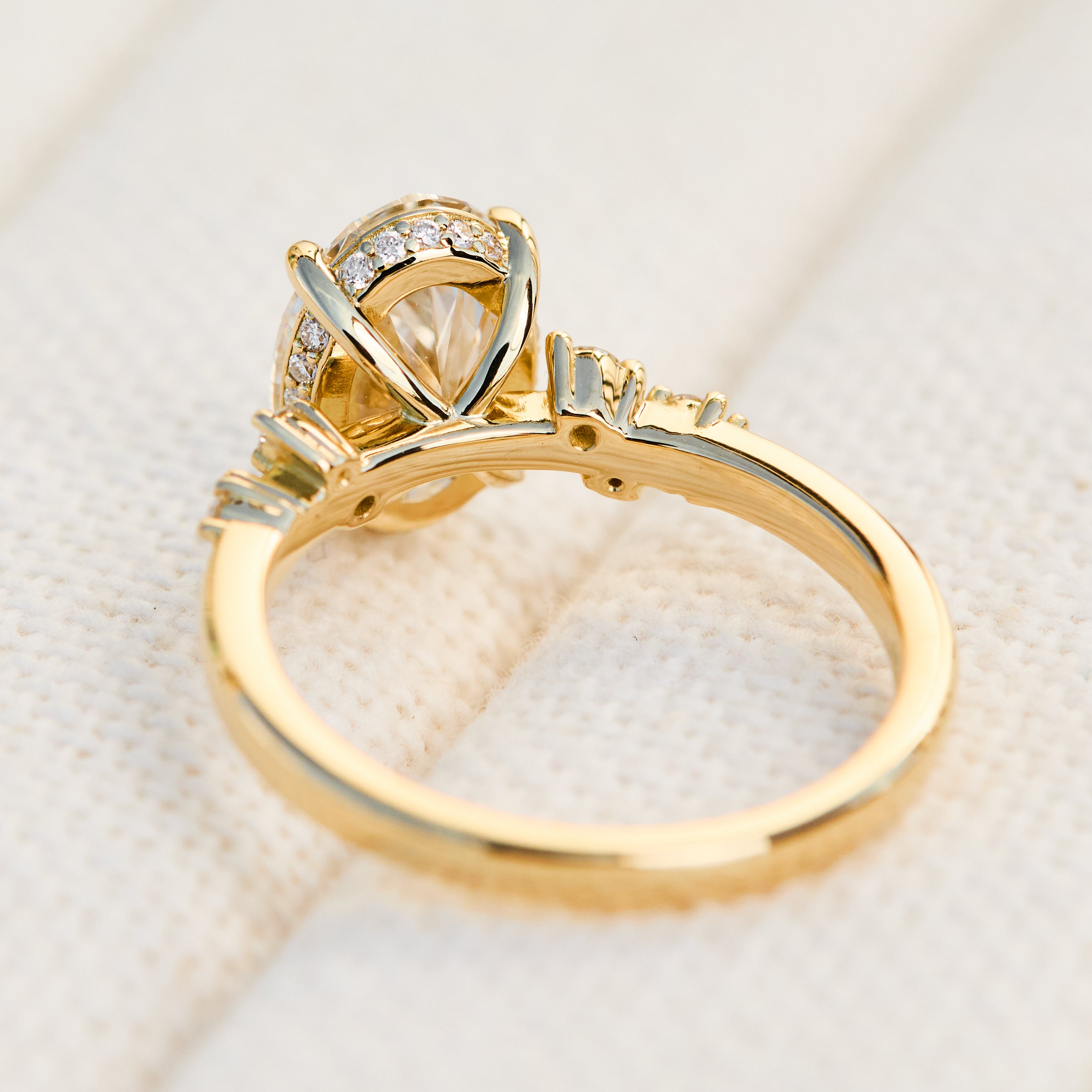 oval lab grown one of a kind diamond engagement ring set in yellow gold