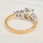 oval opal and diamond engagement ring set in yellow gold and platinum