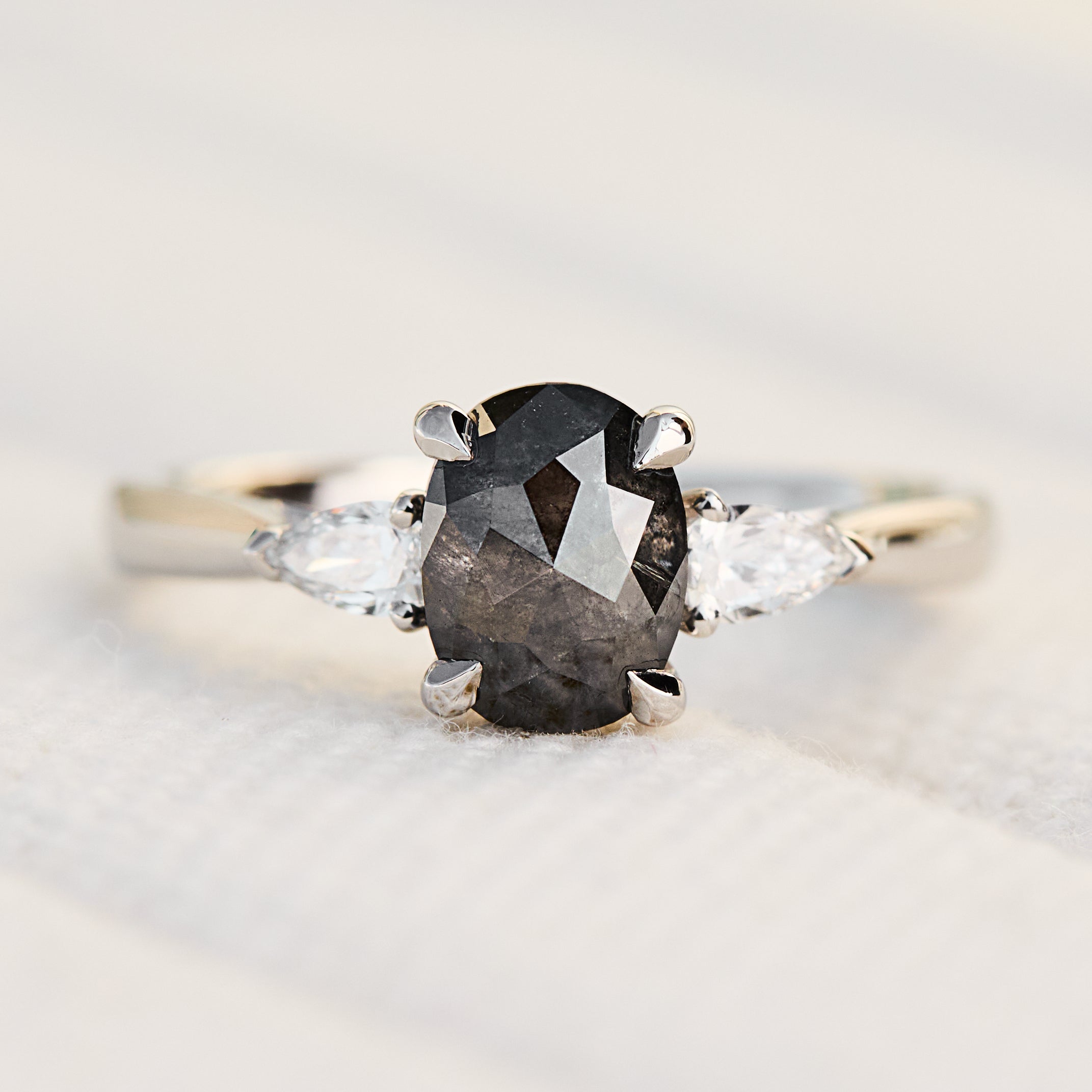 oval rose cut salt and pepper diamond trilogy engagement ring in platinum