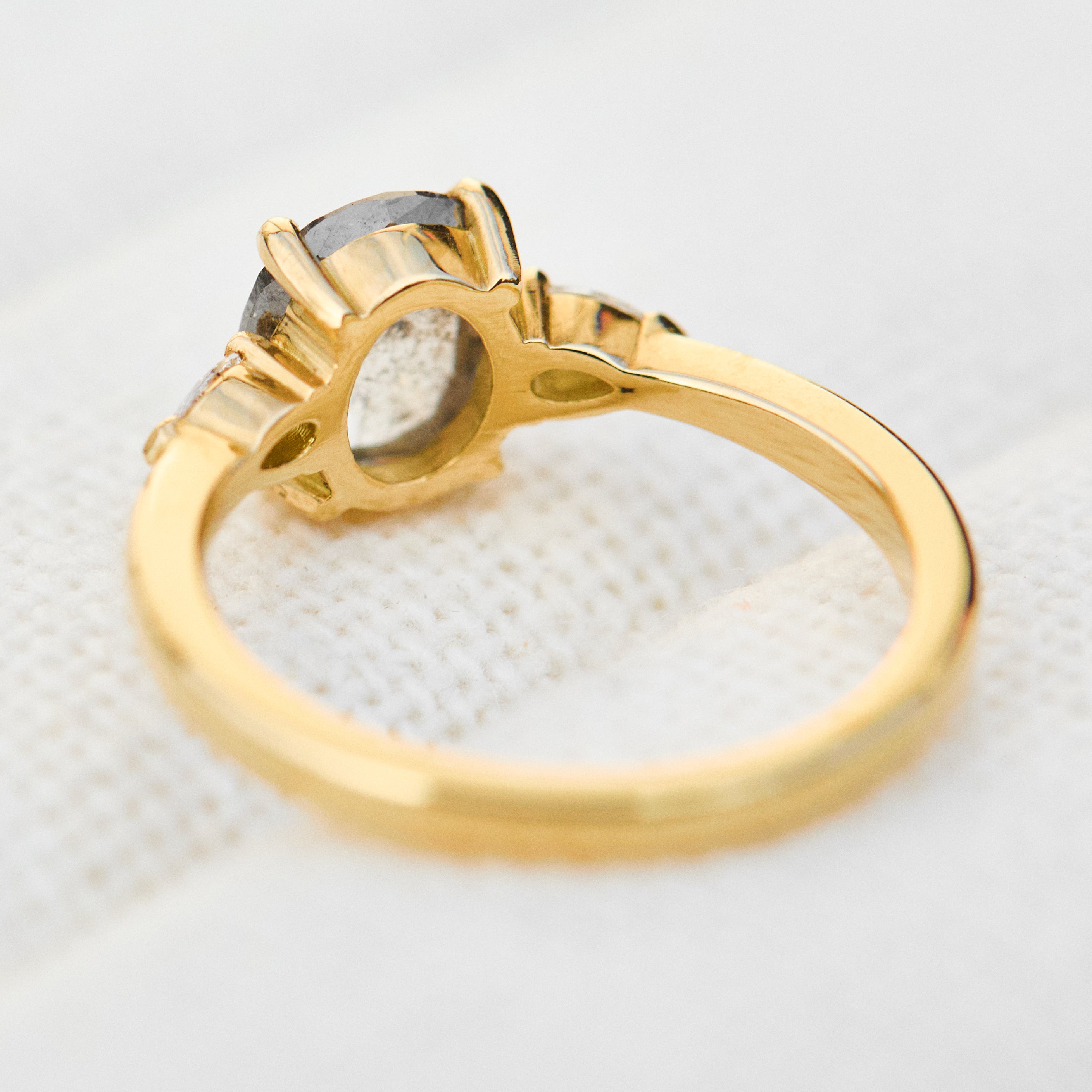 oval rose cut salt and pepper diamond engagement trilogy ring in yellow gold