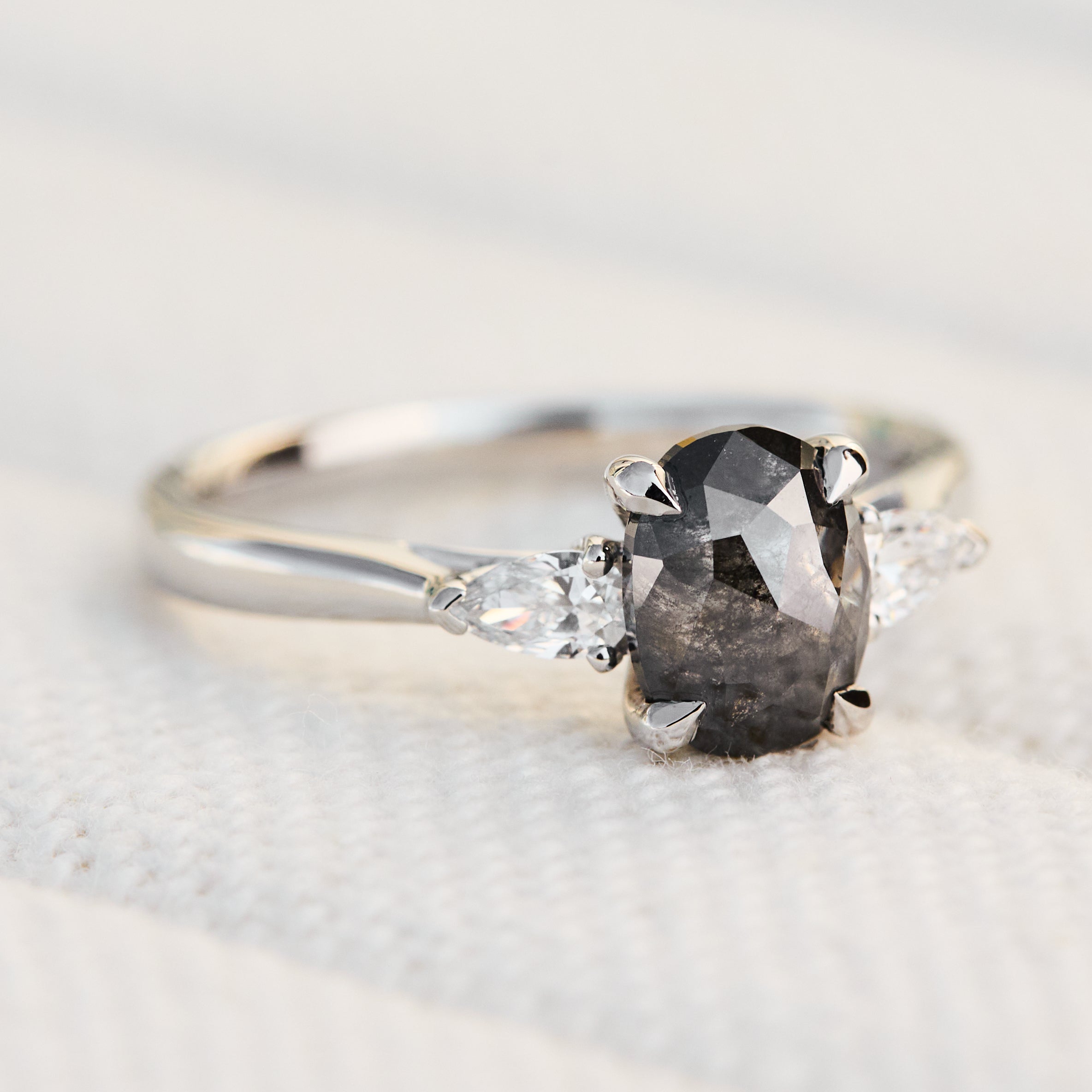 oval rose cut salt and pepper diamond trilogy engagement ring in platinum