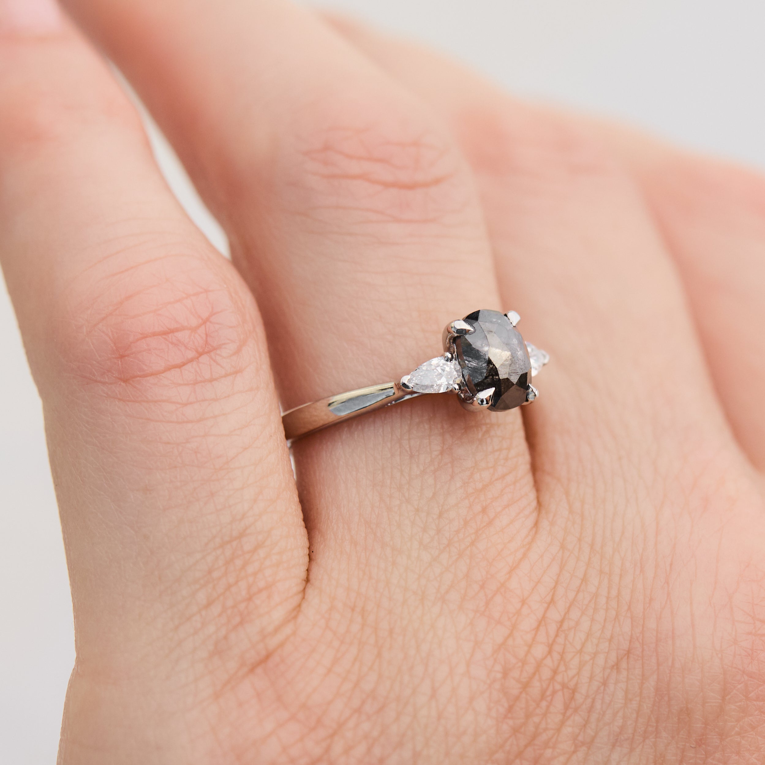 oval rose cut salt and pepper diamond trilogy engagement ring in platinum