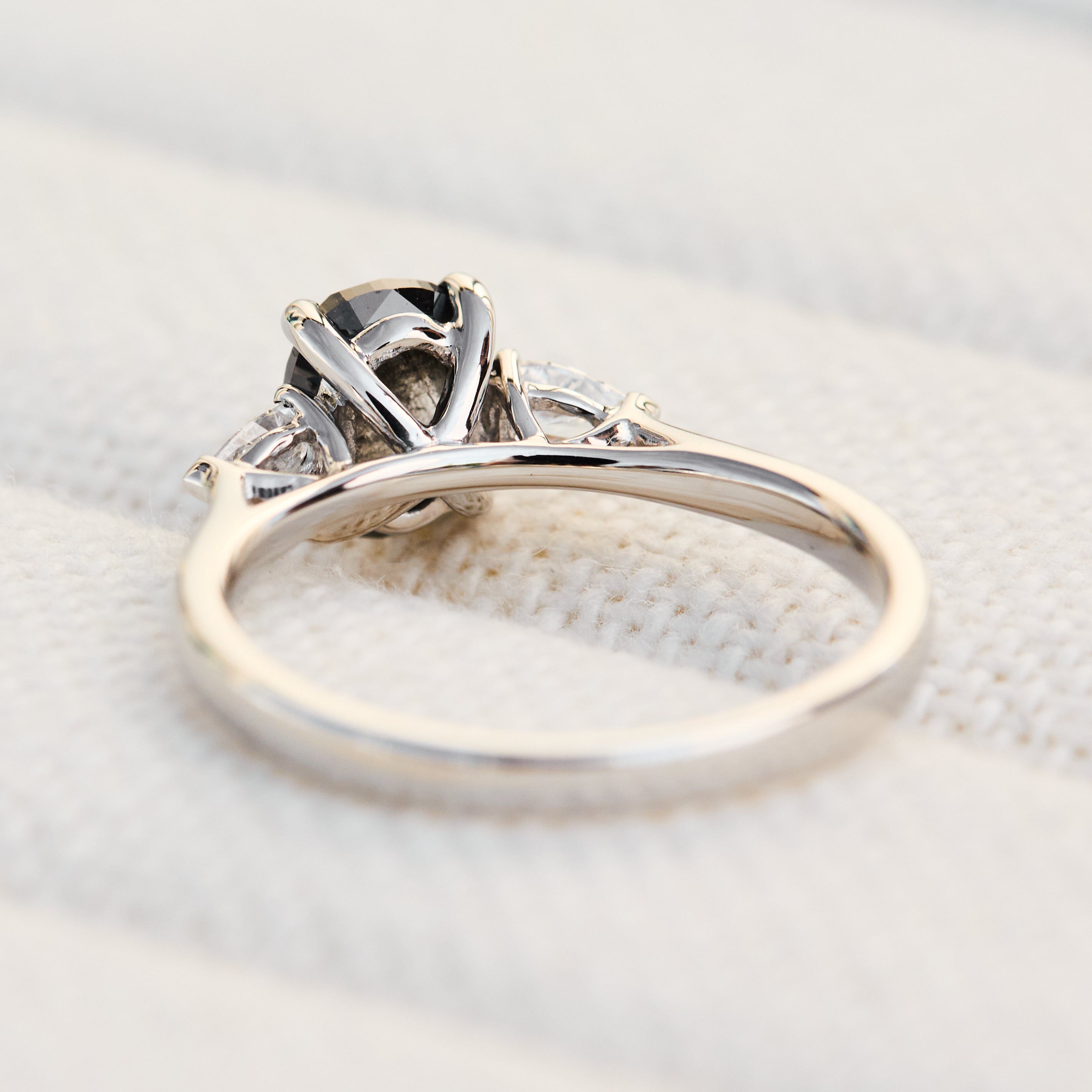 oval rose cut salt and pepper diamond trilogy engagement ring in platinum