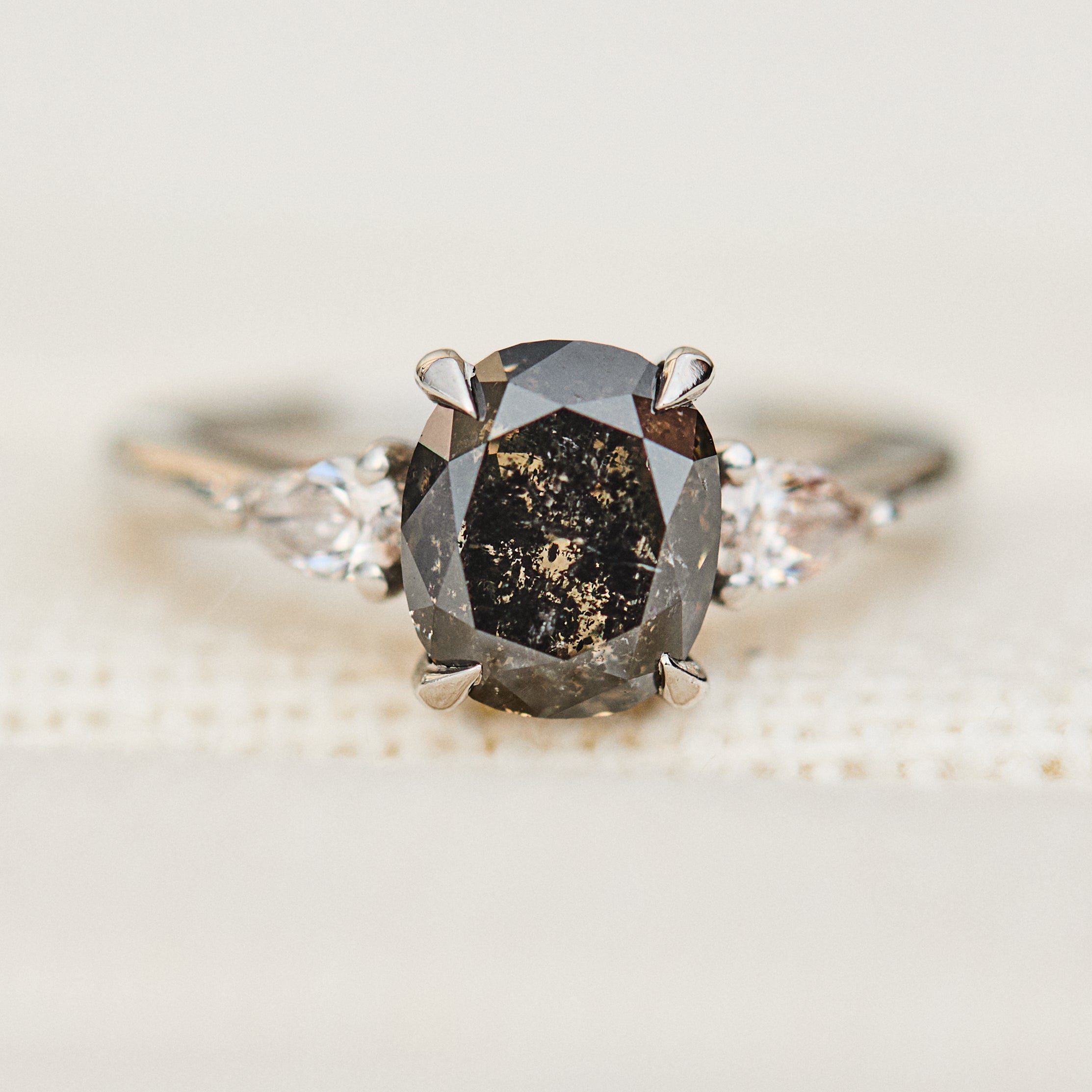 oval salt and pepper diamond trilogy engagement ring