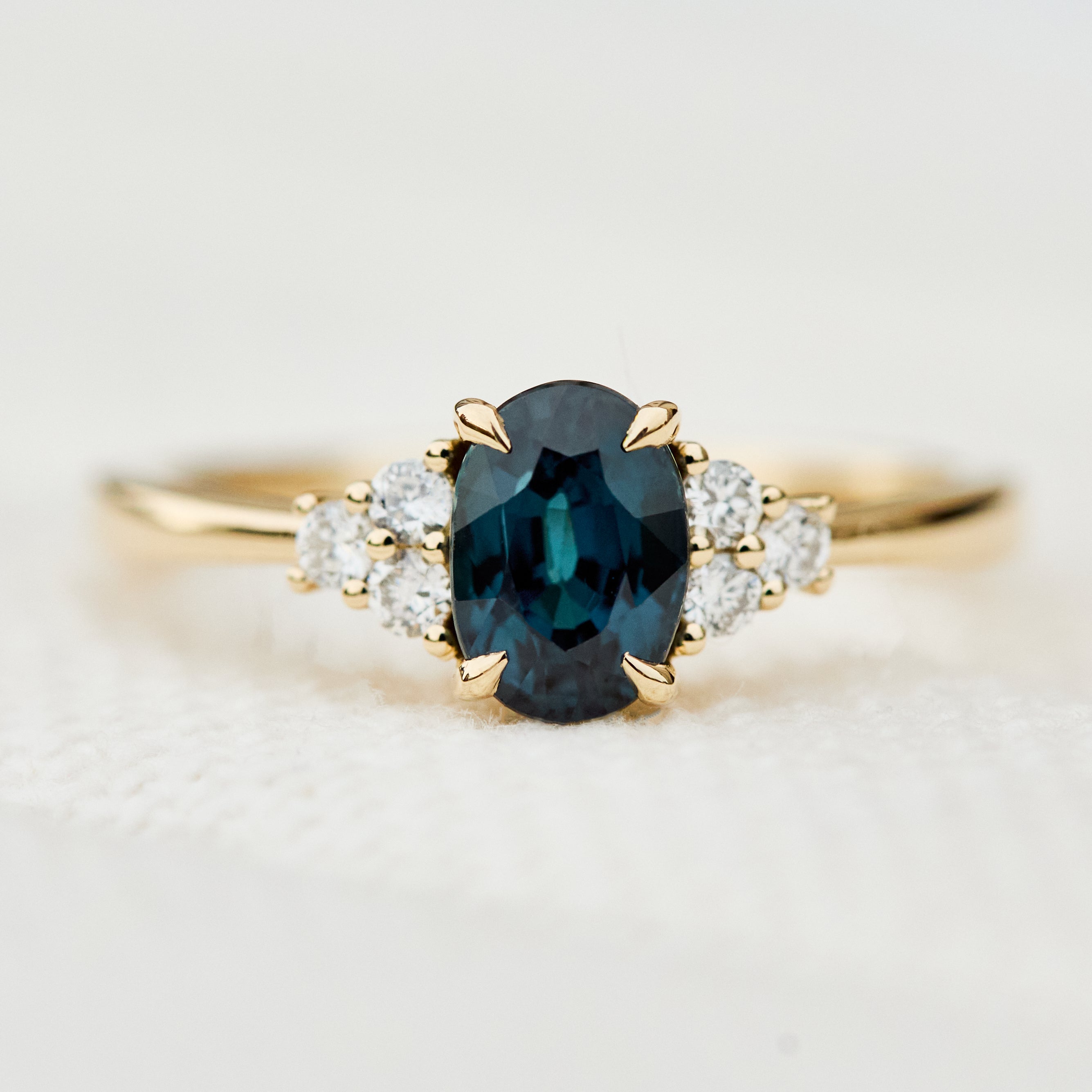 oval teal sapphire yellow gold engagement ring