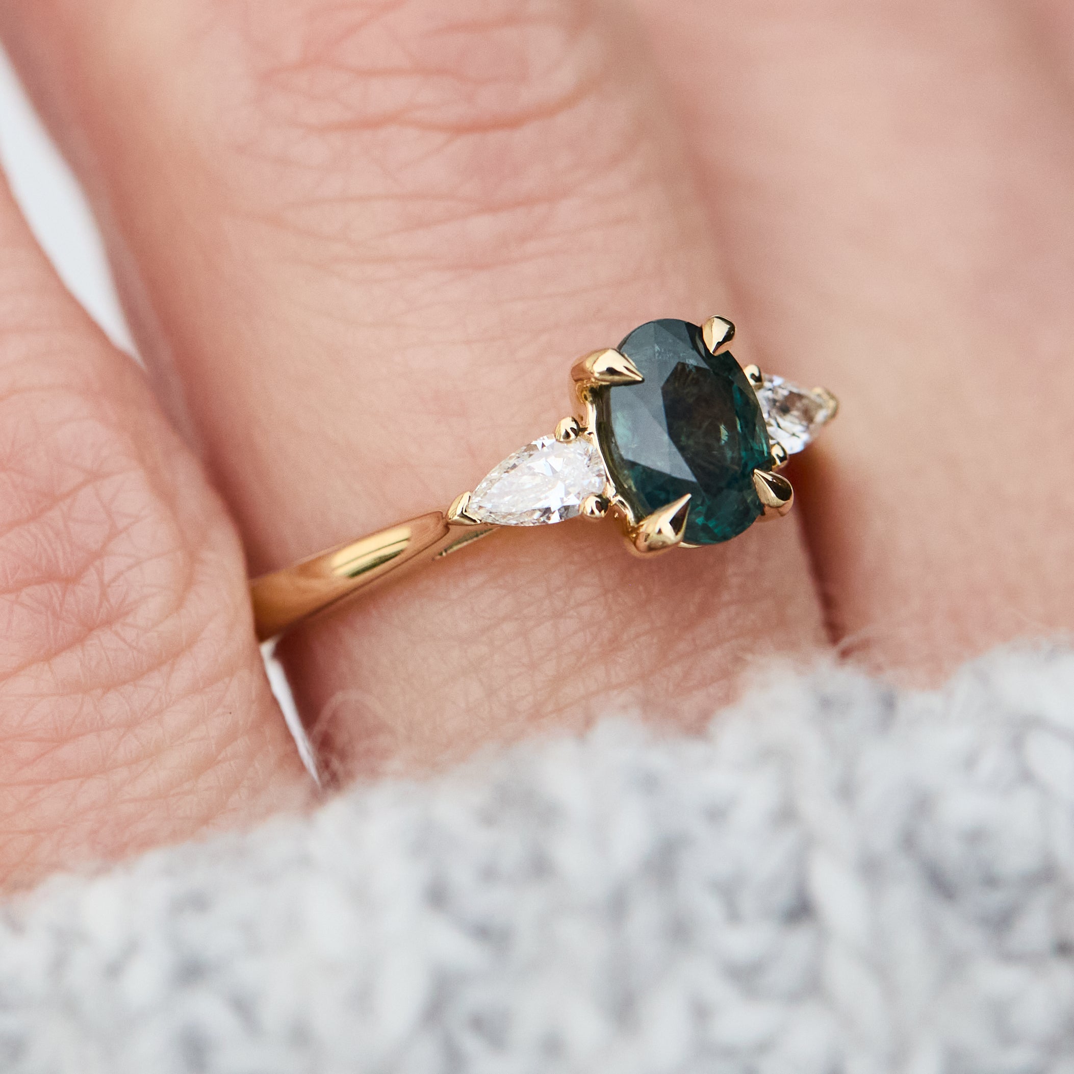 oval sapphire luna setting engagement ring in yellow gold