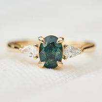 oval sapphire luna setting engagement ring in yellow gold