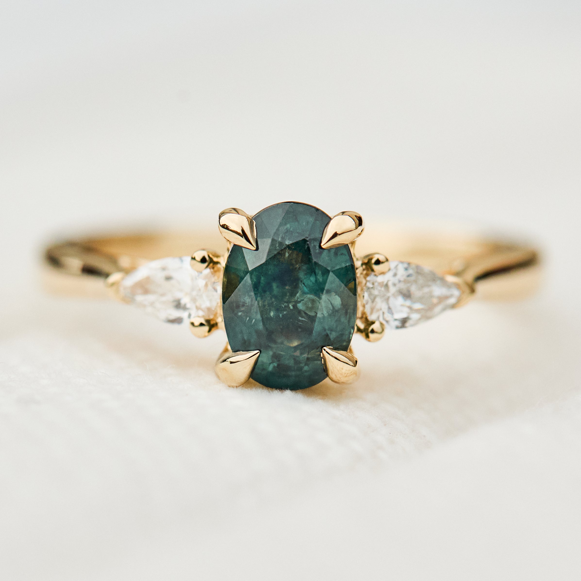 oval sapphire luna setting engagement ring in yellow gold