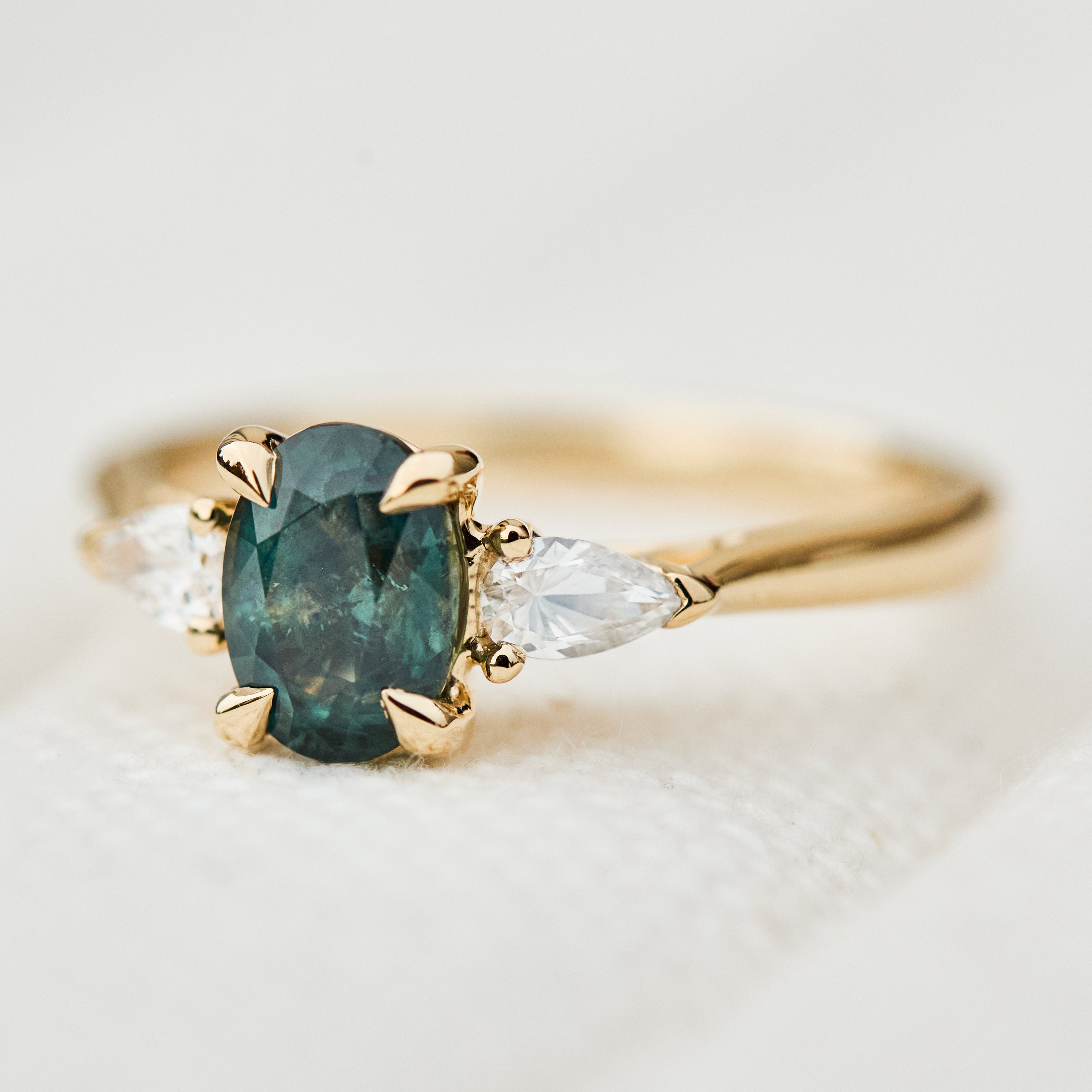 oval sapphire luna setting engagement ring in yellow gold