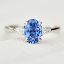 oval sri lankan blue sapphire trilogy platinum engagement ring