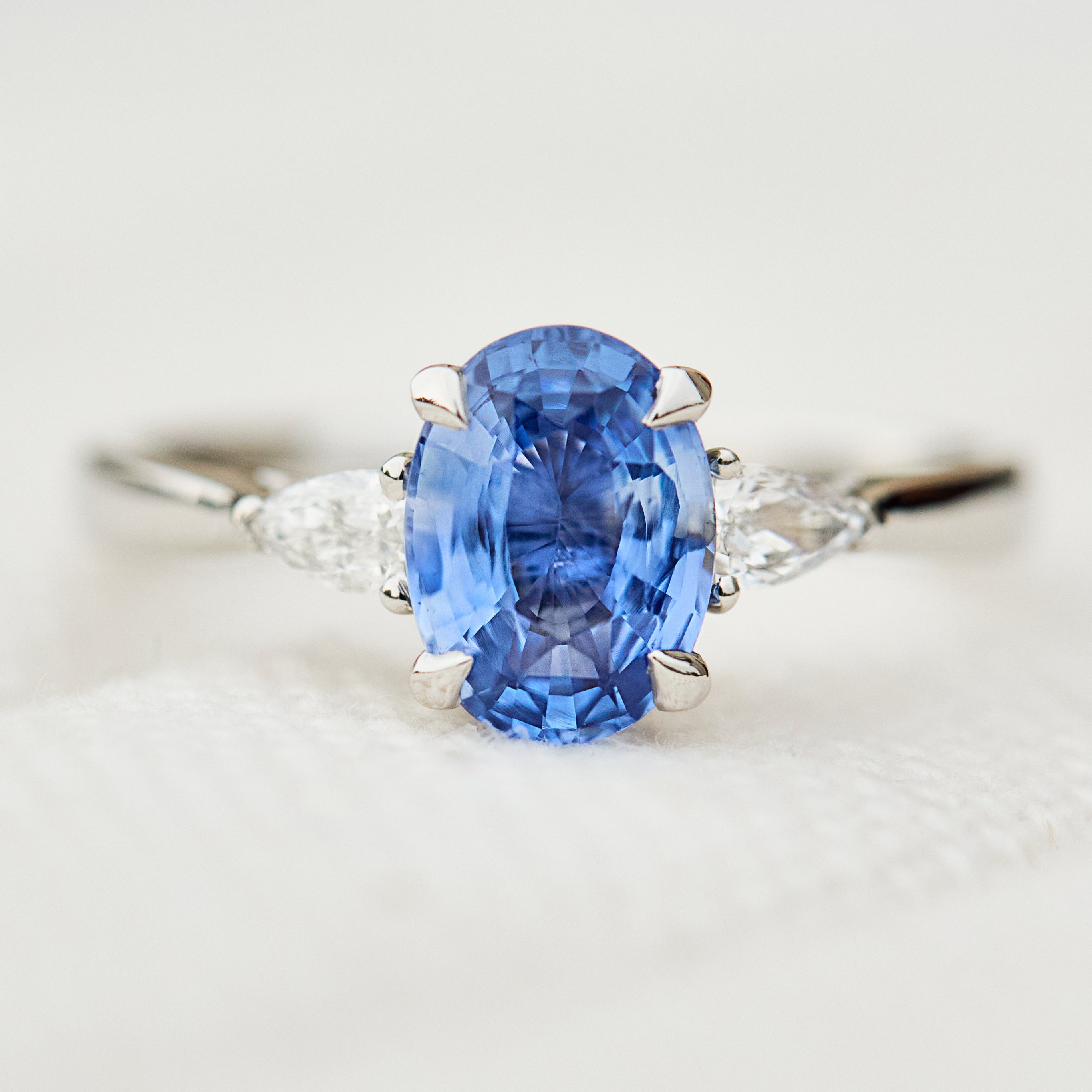 oval sri lankan blue sapphire trilogy platinum engagement ring