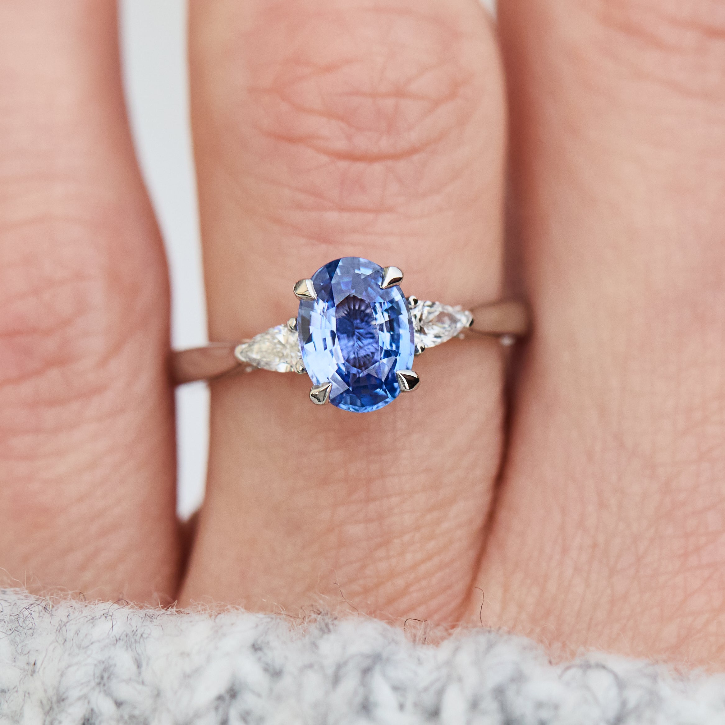 oval sri lankan blue sapphire trilogy platinum engagement ring