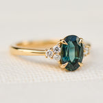 oval teal green sapphire and diamonds yellow gold ring