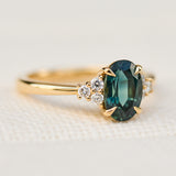 oval teal green sapphire and diamonds yellow gold ring