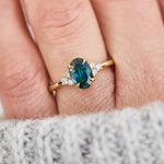 oval teal green sapphire and diamonds yellow gold engagement ring
