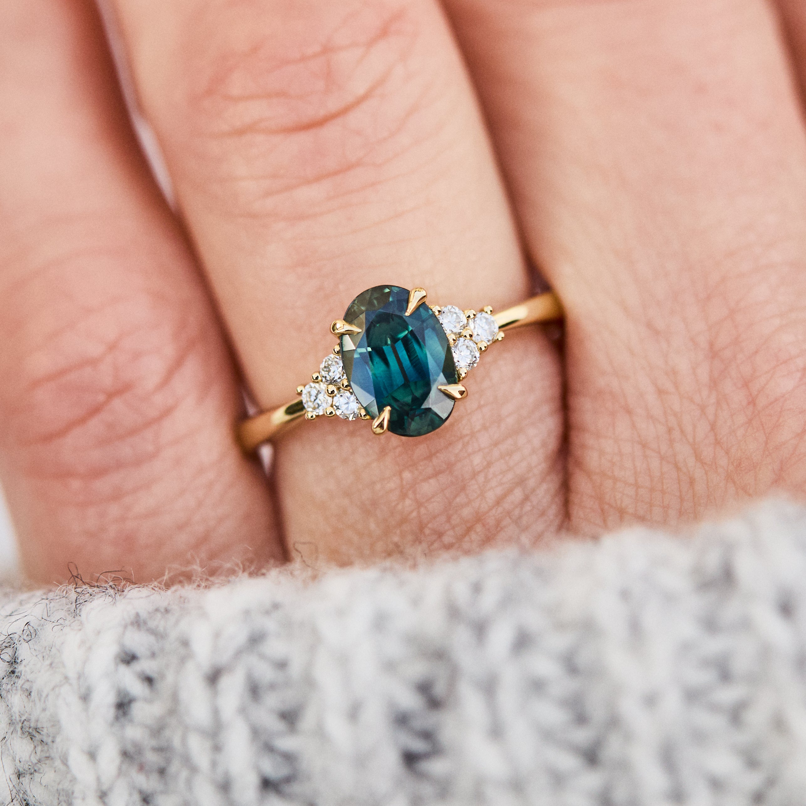 oval teal green sapphire and diamonds yellow gold engagement ring