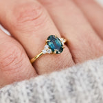 oval teal green sapphire and diamonds yellow gold engagement ring