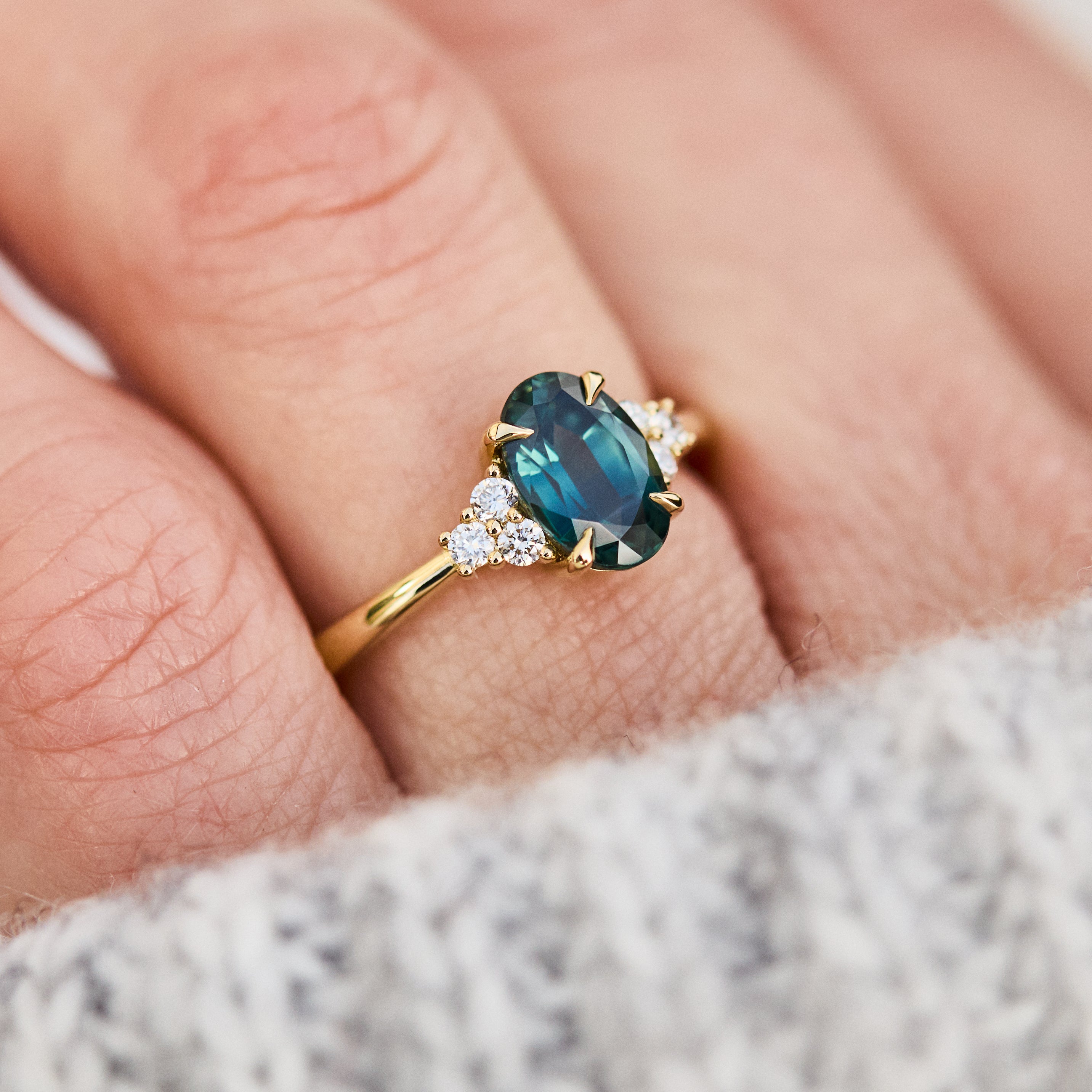 oval teal green sapphire and diamonds yellow gold engagement ring