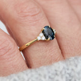 oval teal sapphire yellow gold engagement ring