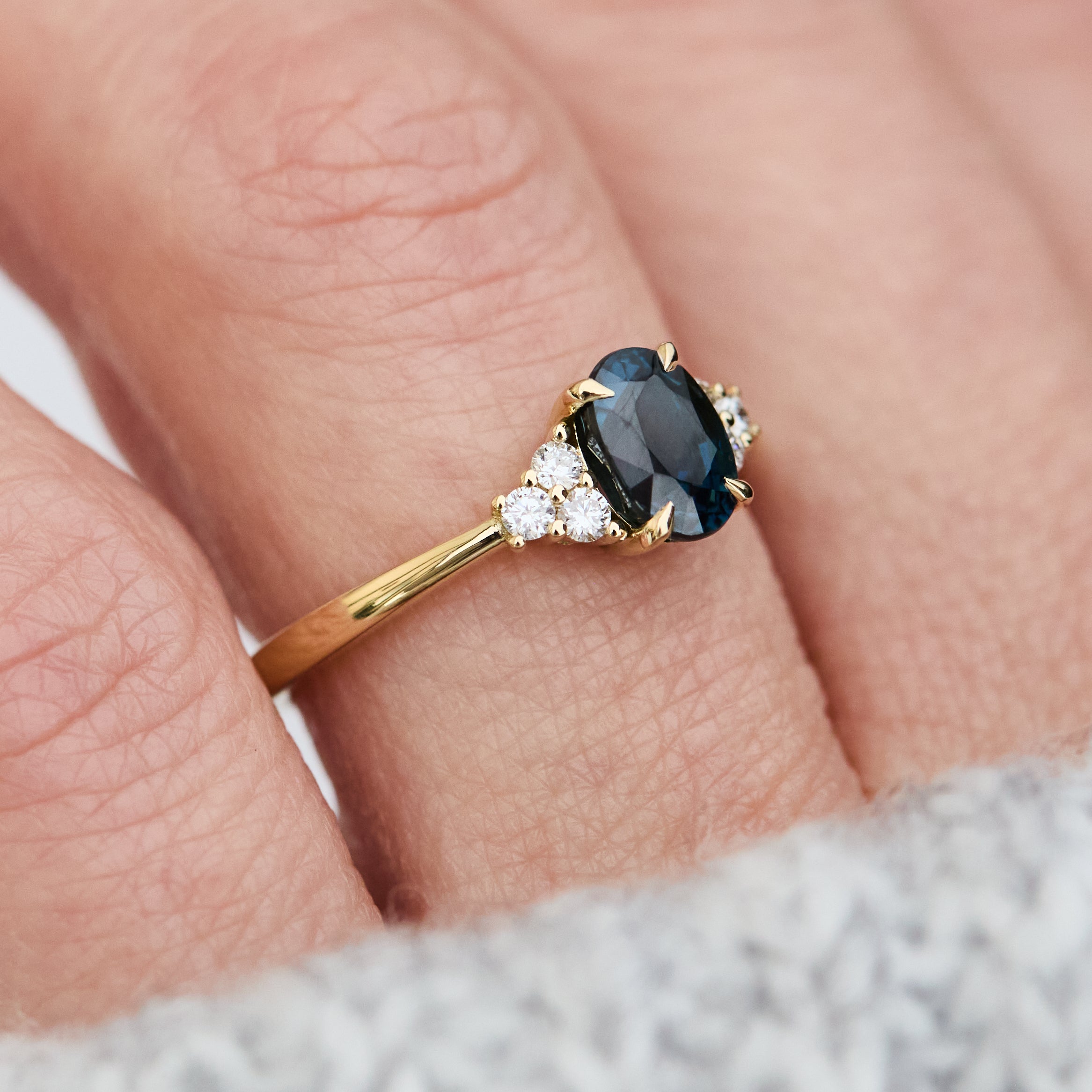 oval teal sapphire yellow gold engagement ring