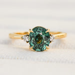 oval teal sapphire yellow gold engagement ring
