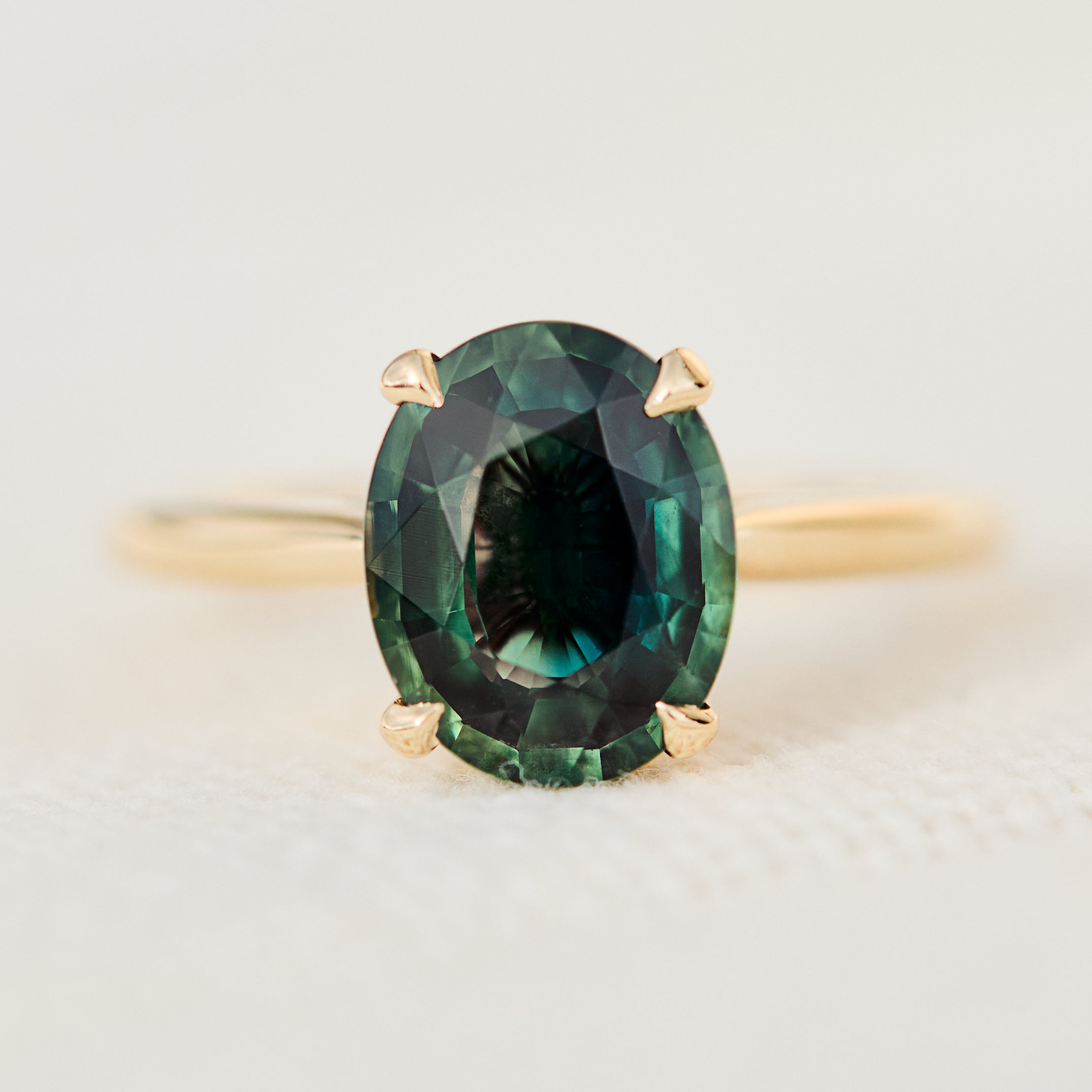 oval teal sapphire solitaire ring