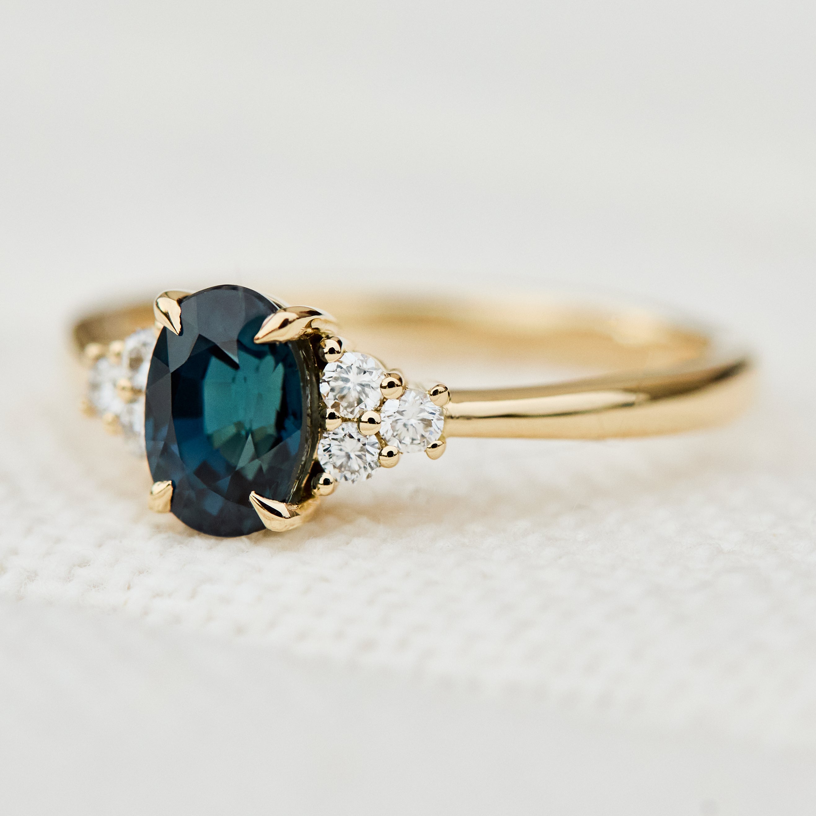 oval teal sapphire yellow gold engagement ring