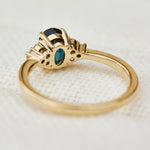 oval teal sapphire yellow gold engagement ring